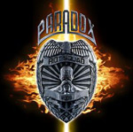 Paradoxin albumin "Riot Squad" etukannessa musta pohjaväri ja sen keskellä suuri kellertävä liekkipallo, jonka päällä rautainen vaakuna. Vaakunan ylle kirjoitettu Paradox ja itse vaakunaan kaiverrettu albumin nimi.