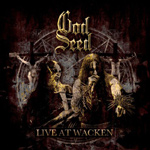"Live At Wacken" -DVD:n kannessa pentagrammin edessä seisovia black metal -muusikkoja. Kuvan yläosassa God Seedin logo.