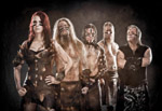 Promokuva Ensiferum-yhtyeestä. Kuvassa viisi muusikkoa rivissä. Vasemmassa laidassa nainen, muut ovat miehiä.